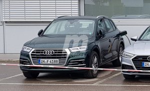 El nuevo Audi Q5 e-tron cazado al desnudo durante una recarga